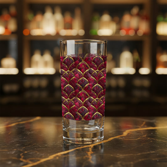 Crimson Jewels highball glass with a ruby and gold design on a bar counter