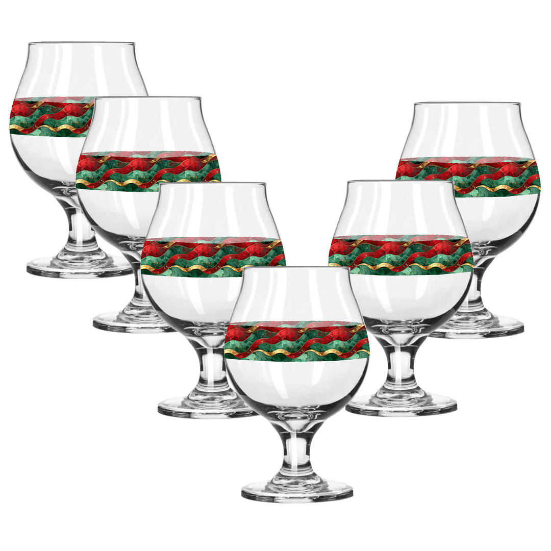Set of six clear glass snifter tumblers with decorative red and green design on a white background