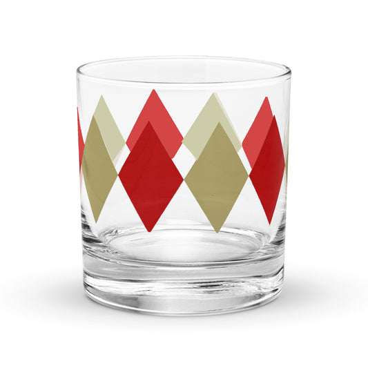 Clear glass tumbler with red and beige diamond pattern on a white background