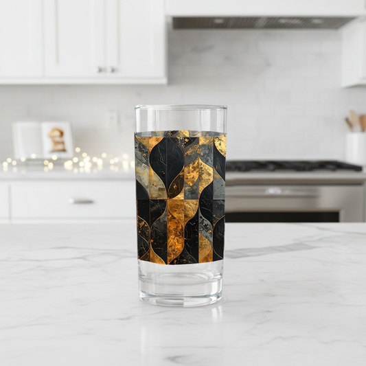 Aged Elegance highball glass with black and bronze design on a kitchen counter