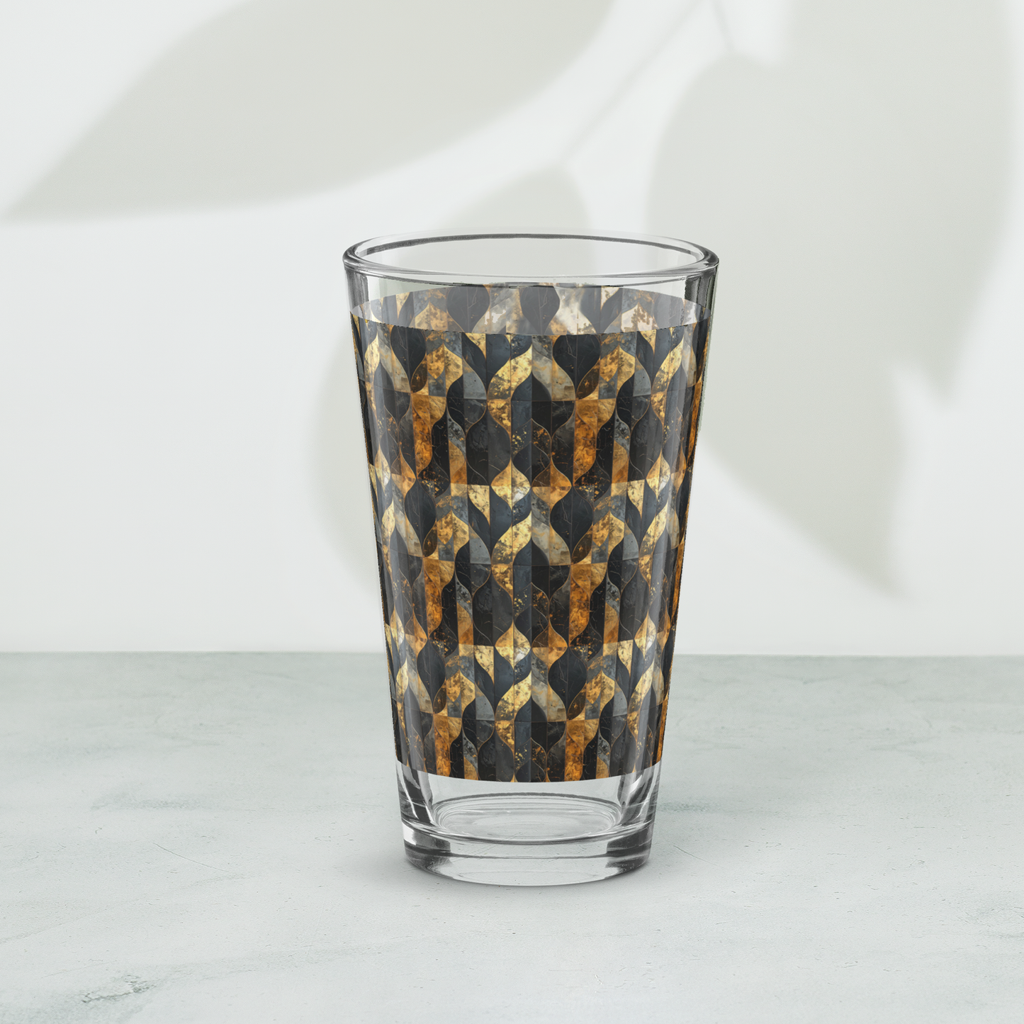 Aged Elegance charcoal and bronze pattern pint beer glass on a white background