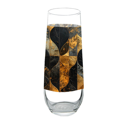 Stemless champagne glasses with charcoal and bronze geometric design on a white background