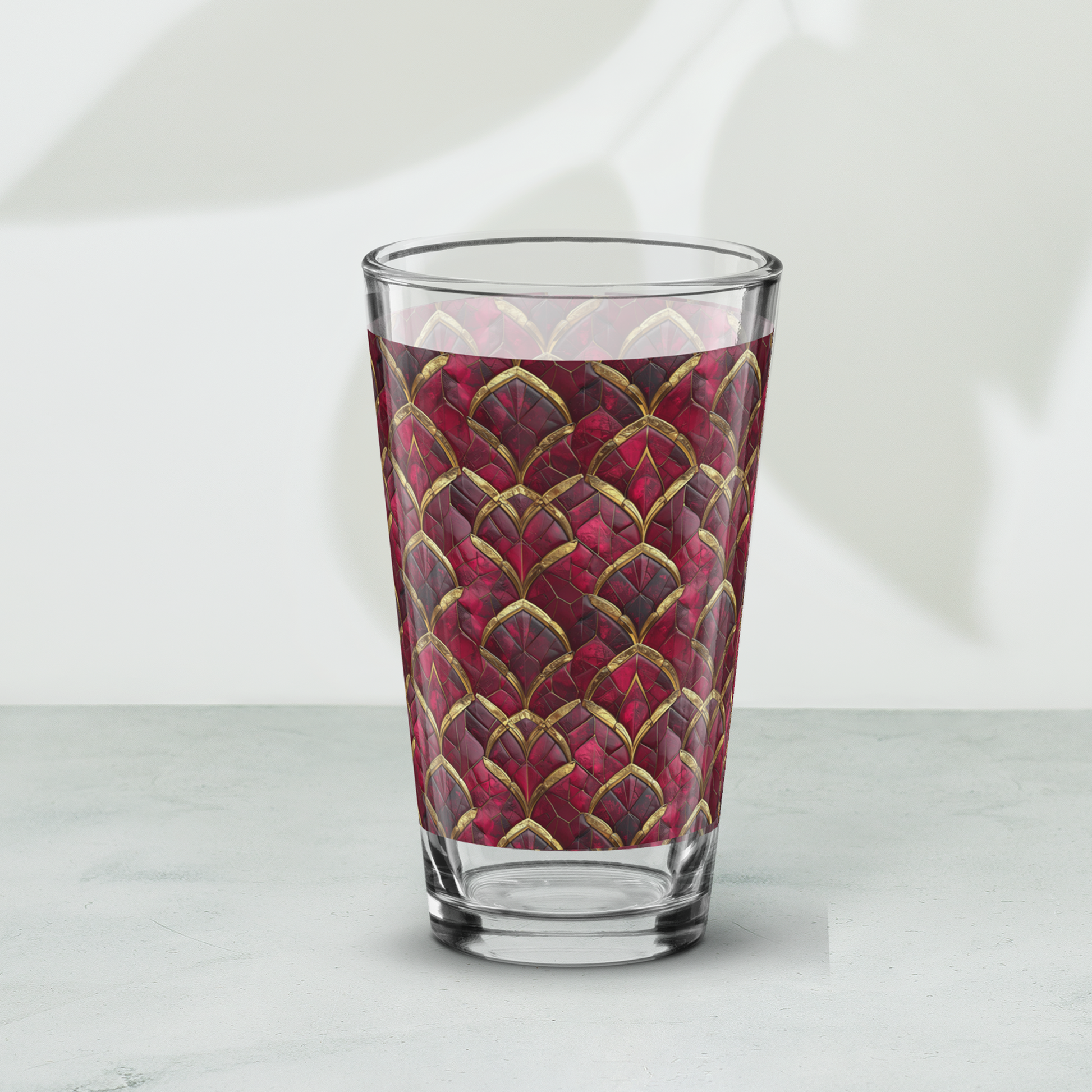 Crimson Jewels pint beer glass with ruby and gold design on a white background