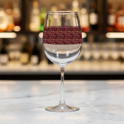 Crimson Jewels tall wine glass with ruby and gold design on a bar counter