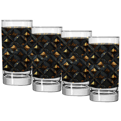 Set of four highball glasses with black and gold geometric pattern on a white background