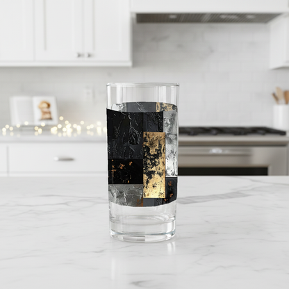 Frescro Fragments highball glas  with black, silver, and gold design on a kitchen counter