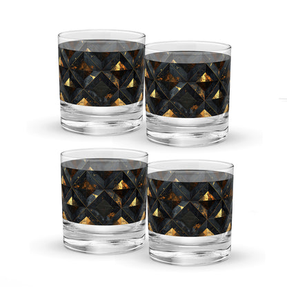 Four rock glasses with geometric black and gold pattern on a white background