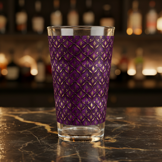 Royal Opulence plum and gold  decorative clear glass on a dark marble surface with blurred bar background