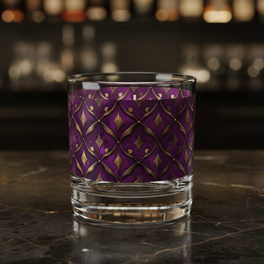Royal Opulence rocks decorative glass with plum and gold pattern on a dark surface and blurred background.