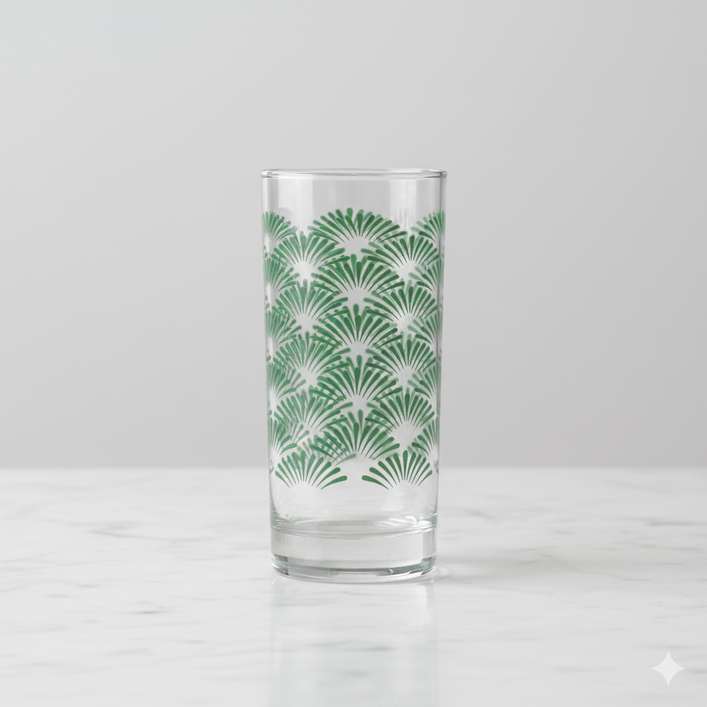 Green Deco highball glass with an Art-Deco design on a gray background