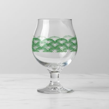 Green Deco Belgian beer glass with an Art-Deco design on a light gray background