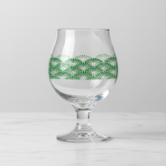 Green Deco Belgian beer glass with an Art-Deco design on a light gray background