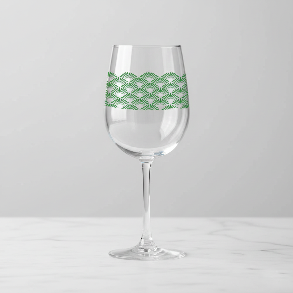 Deco Green tall wine glass with green fan-motif pattern on a white background