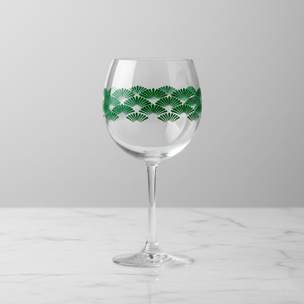 Green Deco balioon wine glass with green Art-Deco fan design on a light gray background