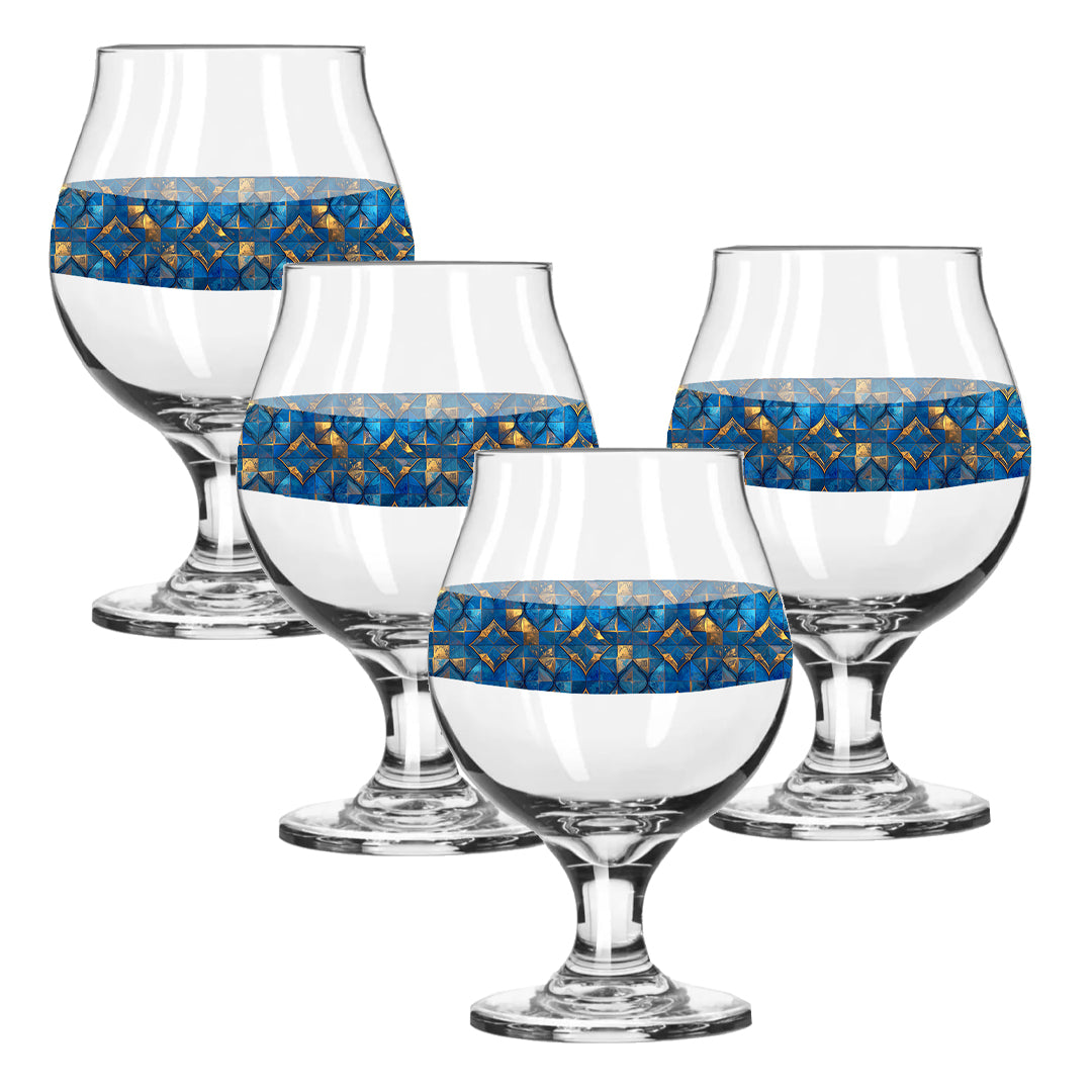 Set of four Belgian beer glasses with turqoise and gold geometric design on a white background