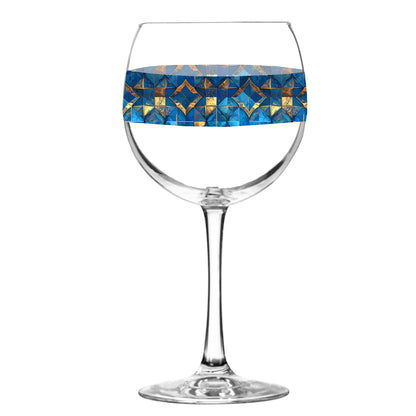 Balloon wine glass with turqoise and gold geometric design on a white background