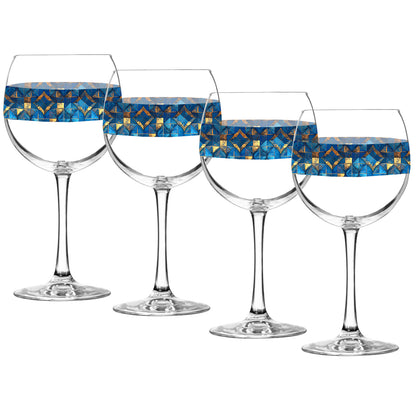 Set of four balloon wine glasses with turqoise and gold geometric design on a white background