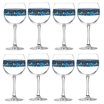Set of eight balloon wine glasses with turqoise and gold geometric design on a white background