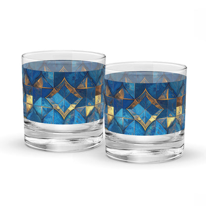 Two rock glasses with turqoise and gold geometric design on a white background