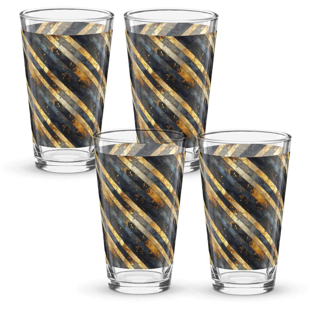 Four pint beer glasses with black and gold striped design on a white background