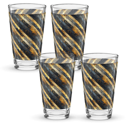 Four pint beer glasses with black and gold striped design on a white background