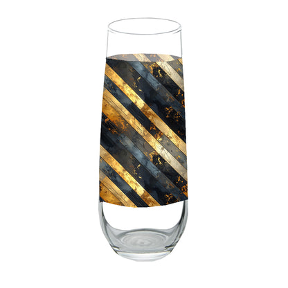 Stemless champagne flute glass with black and gold striped design on a white background