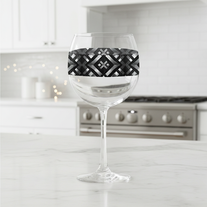 Palazzo Tiles balloon wine glass with gray and silver geometric designon a kitchen counter