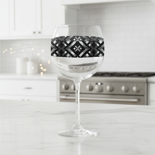 Palazzo Tiles balloon wine glass with gray and silver geometric designon a kitchen counter