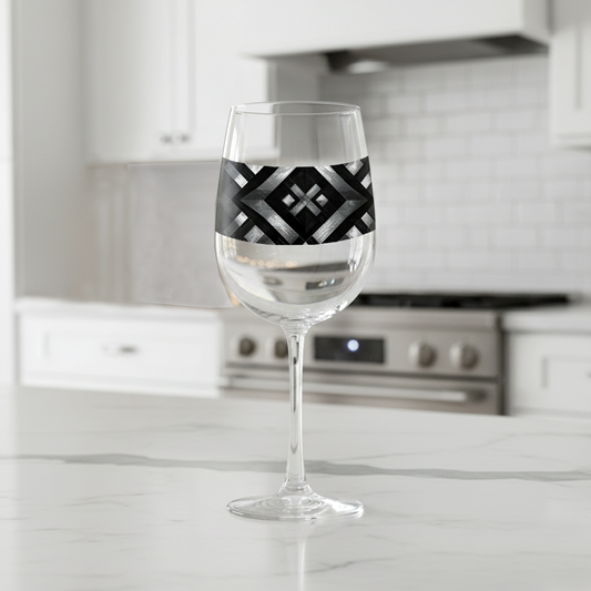 Palazzo Tiles tall wine glass with with geometric silver and black design on a marble countertop