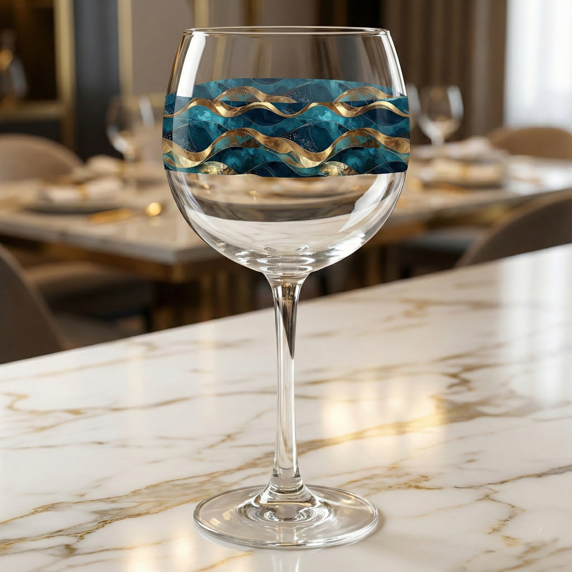 Opulent Teal balloon wine glass closeup on a marble countertop, showcasing wide bowl and sophisticated teal and gold marbling design.