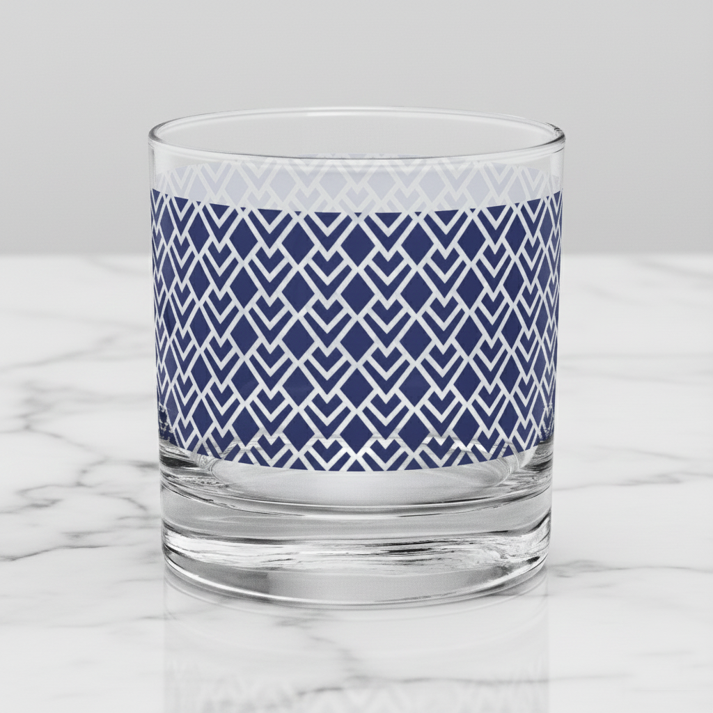 Sapphire Deco  old-fashioned glass  with blue Art-Deco design on a marble surface